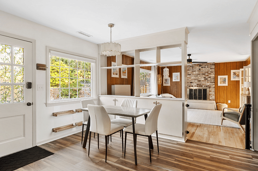 The kitchen has an eat-in smaller table that is open floor plan to the den for entertaining and relaxing.