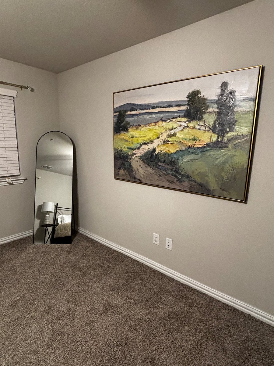 Primary bedroom art and full length mirror.