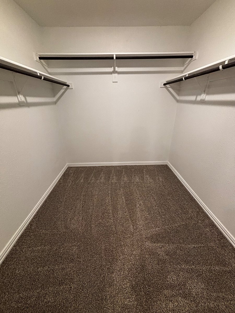 Primary suite walk-in closet.