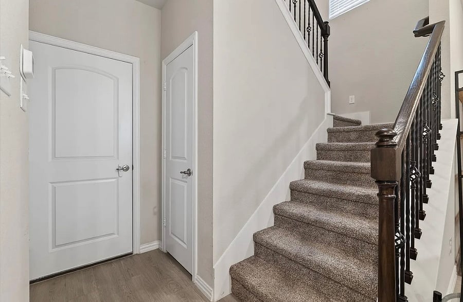 Stairway to second level - 3 bedrooms, 2 bathrooms, and laundry room.