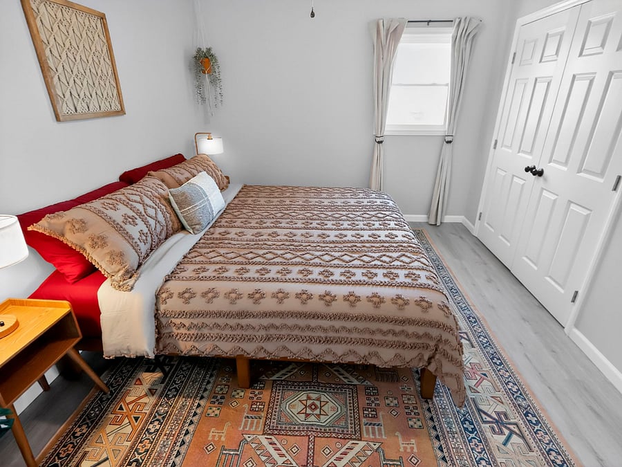 2nd floor / bedroom 1 / king bed / closet / hanging organizer / ceiling fan / portable fans as well / AC in every room 