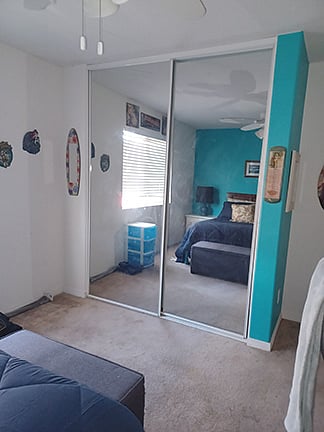 Dual full sized mirrored closet.