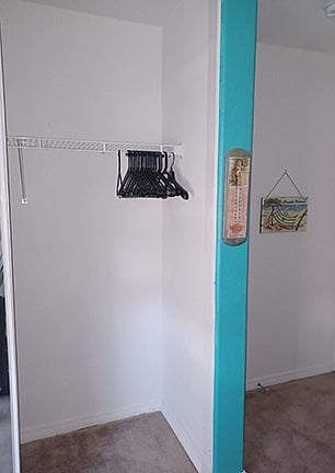 Right side of closet when open. Includes use of hangers shown