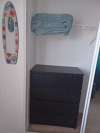 Left side of closet when open. Includes use of dresser shown and extra blanket.