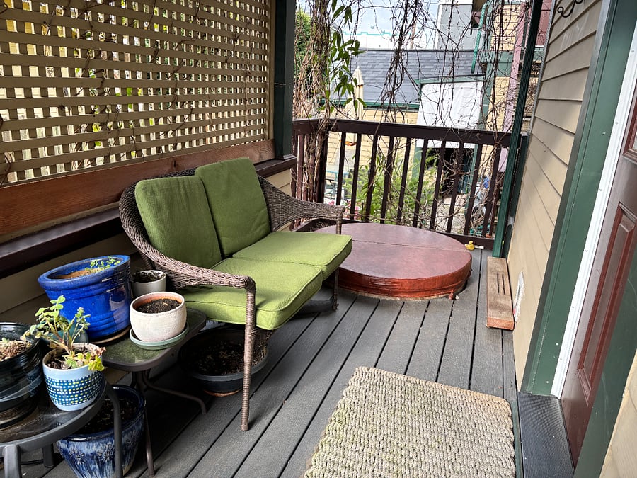 Side deck with hot tub.
