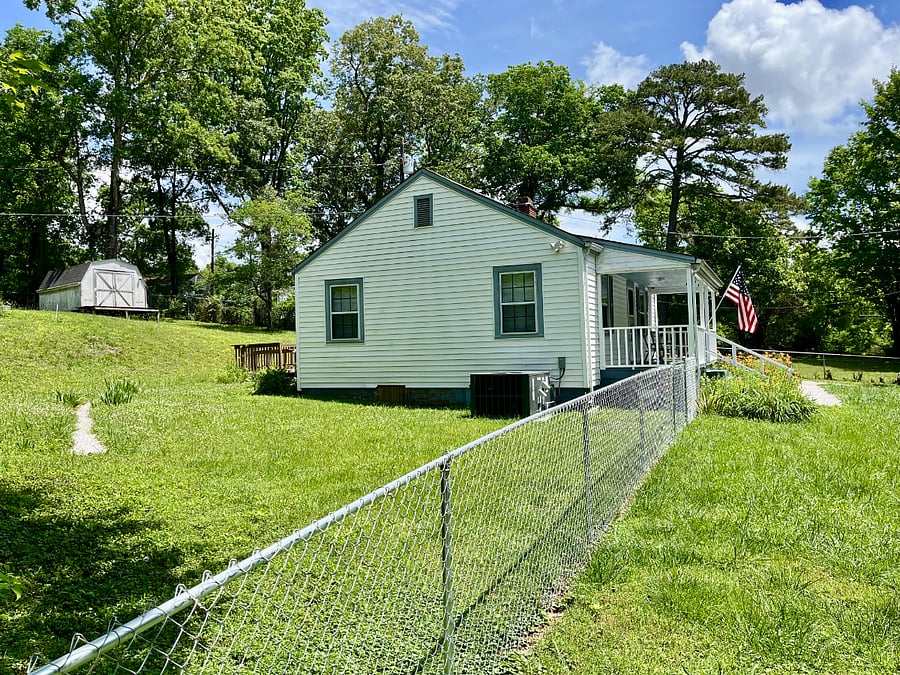 Side yard with a view of backyard in May  (Memorial Day 2026).