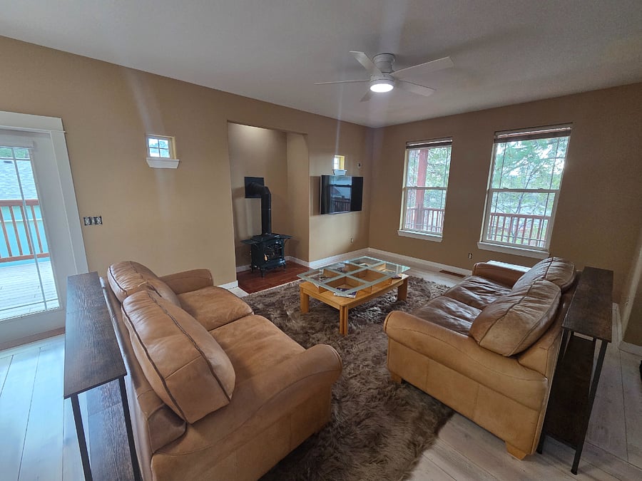 Large living room with two leather sofas.