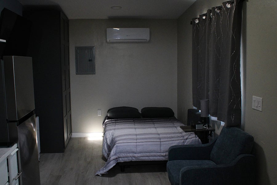 Blackout shades. Couch converted to full size bed.