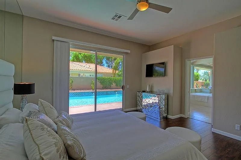 Wake up to shimmering pool views from your king bed  the master suite is your own private escape
