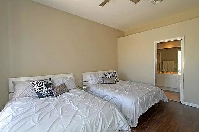 Comfortable queen beds and a clean, relaxing vibe make this room perfect for kids or extra guests.