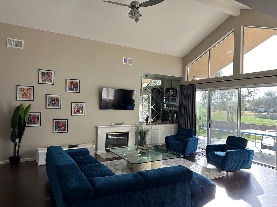 Sink into plush velvet seating by the fireplace while soaking in sweeping golf course views through floor-to-ceiling windows