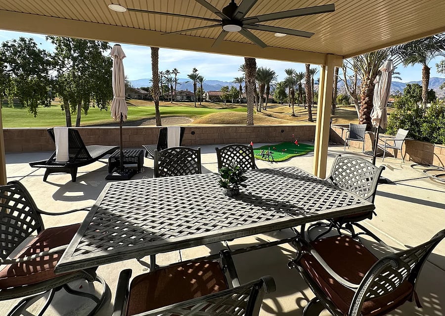 Al fresco dining under the covered patio  grab a seat and enjoy a meal with golf course panoramas