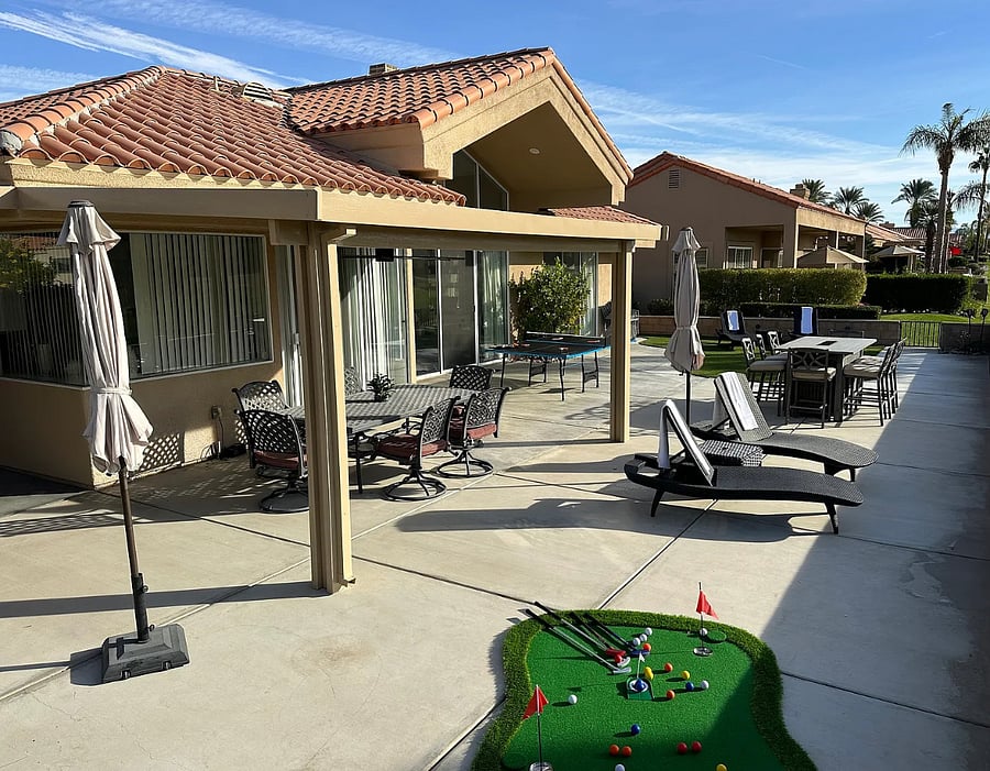 Two covered patios with lights and large fans