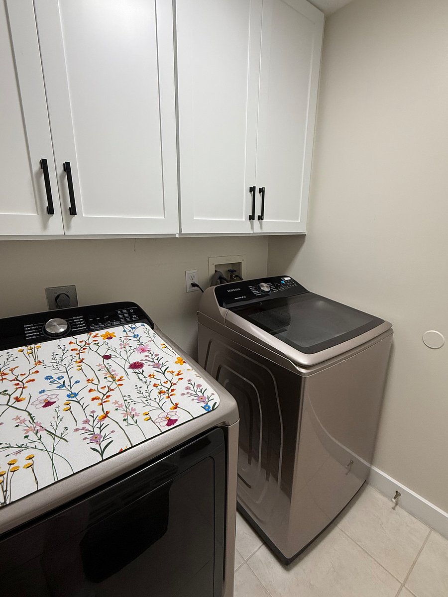 Washer and dryer, utility room with cordless vacuum and all supplies needed for your stay!