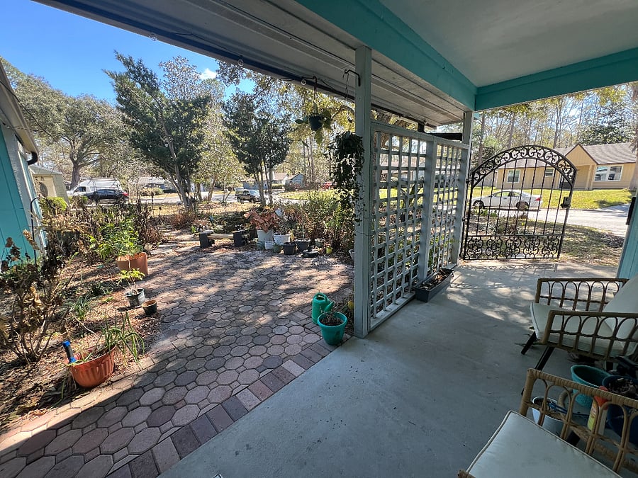 Front courtyard with seating areas and small pond