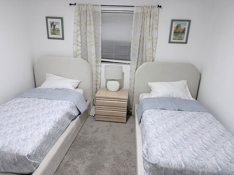 Two twin beds with new mattresses.