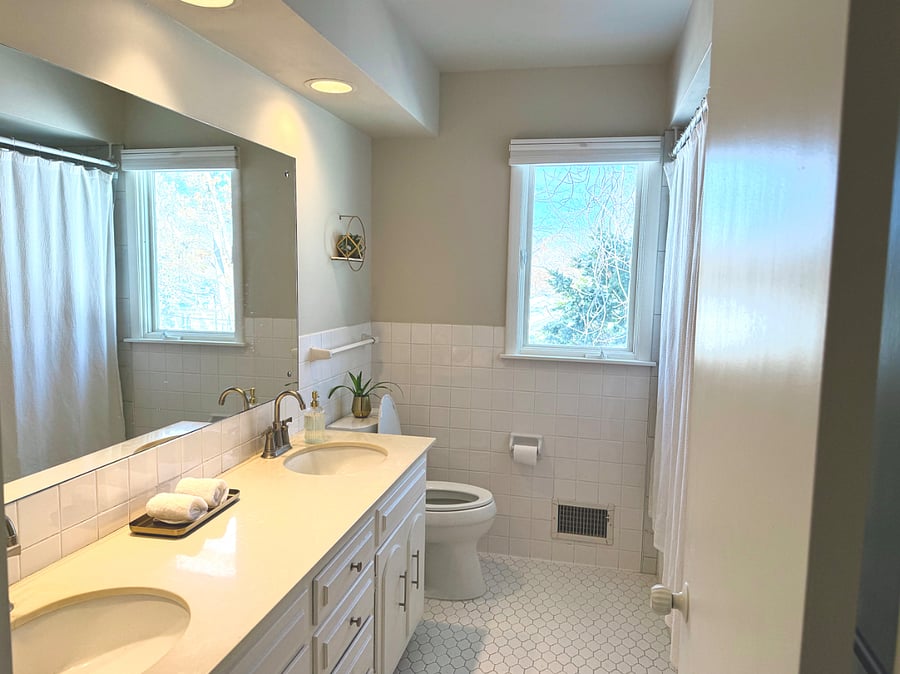 Full Bath with cast iron tub and storage- Main Level - West facing window