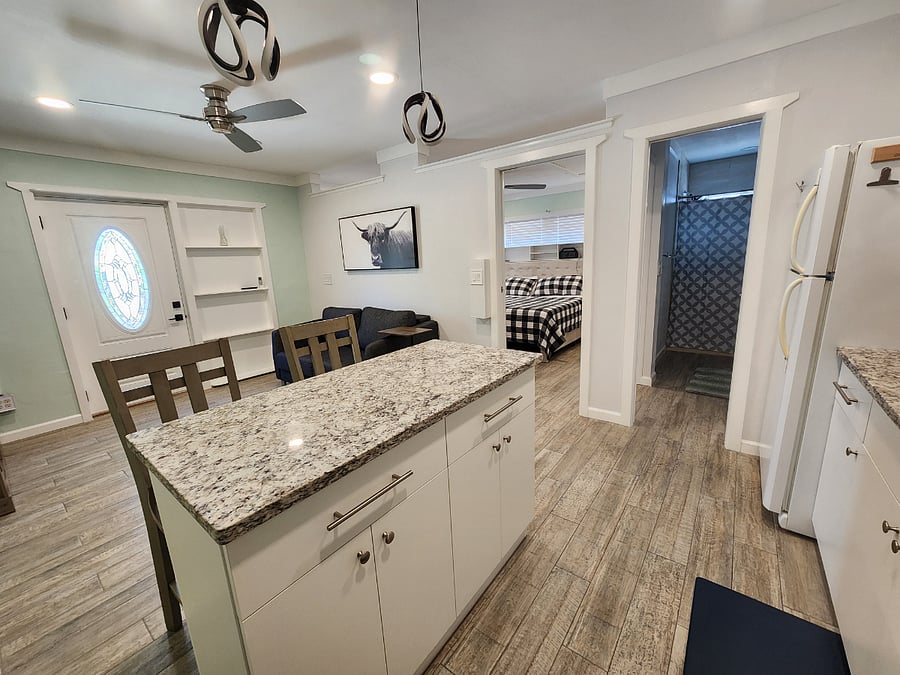 From the corner of the kitchen facing bedroom and bathroom.