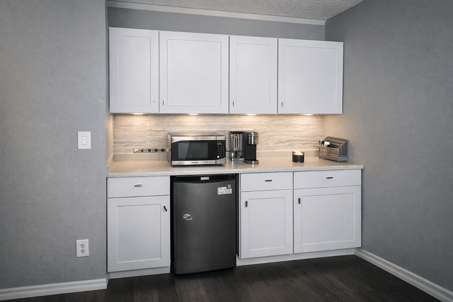 In-Suite Kitchenette with Kurig, Microwave and Mini Fridge.