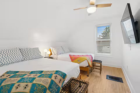 Bedroom 3 with two (2) full-size beds, full-length mirror, and large walk-in closet