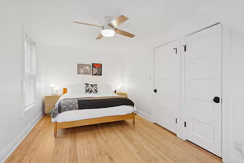 Bedroom 1 with one (1) king-size bed, walk-in closet and reading nook (two black chairs found in separate picture)