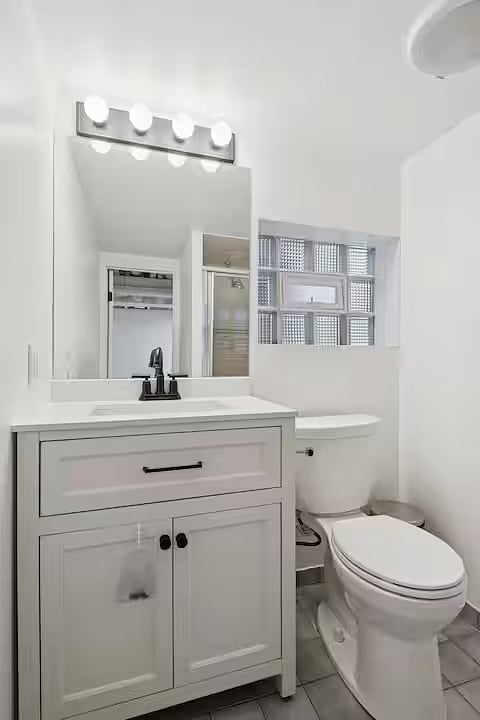 Bathroom 3 - basement level (walk in shower seen in mirror)