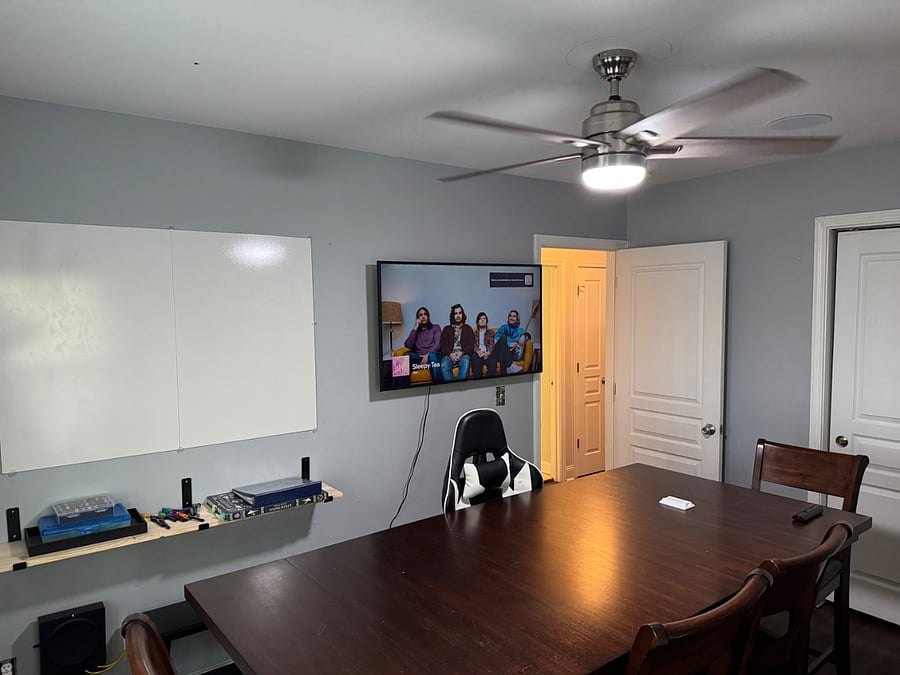 White board and tv in the hobby room.