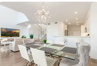 Open concept living/dining/kitchen make this villa light and bright year round. 