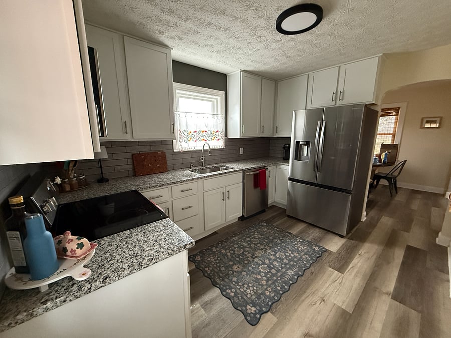 Kitchen, view from the back door, looking into the dining room.