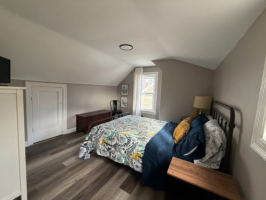 Upstairs bedroom w/ attic access for additional storage.