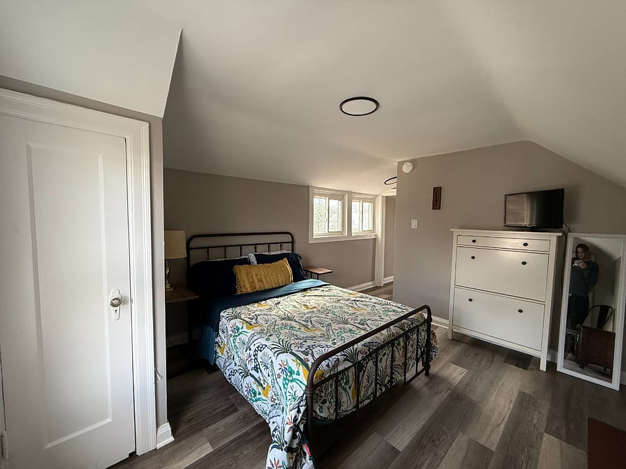 Upstairs bedroom w/ closet and full size bed.