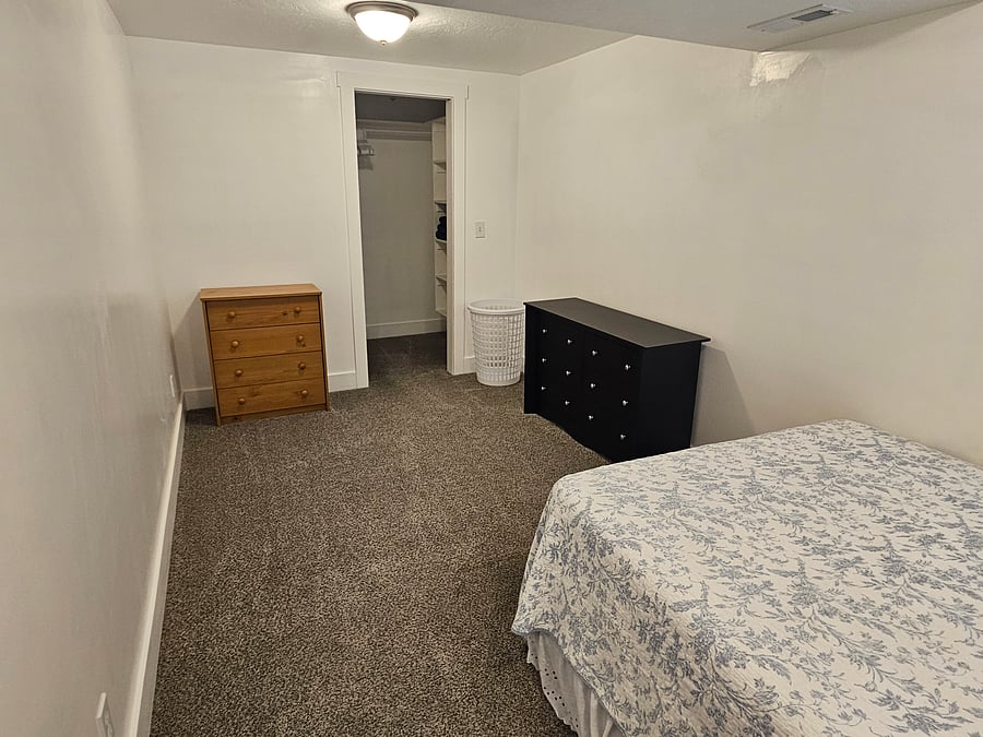 Bedroom with walk in closet, Full Bed.