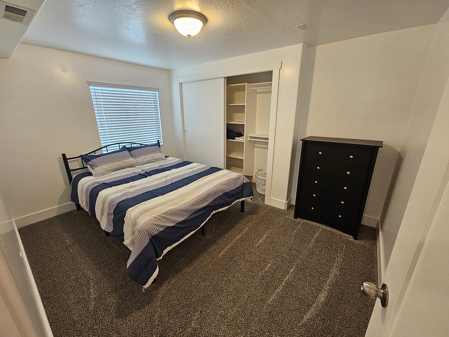 Bedroom #2 with a Queen bed.
The valve for the sprinklers is behind a cabinet door in the closet. Homeowner will need access in the spring and fall for the sprinkler system to be operational. 