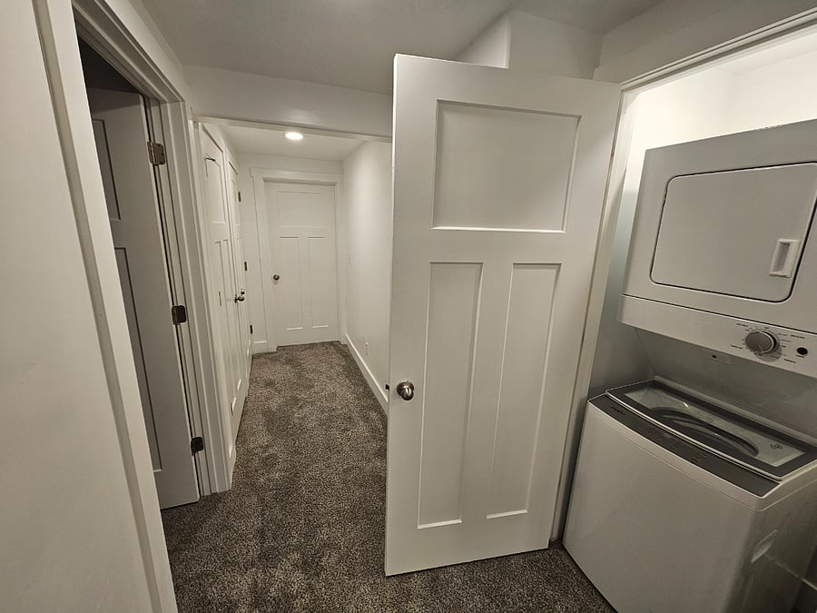 Hallway to bedroom and stair storage. Additional bedroom unavailable.