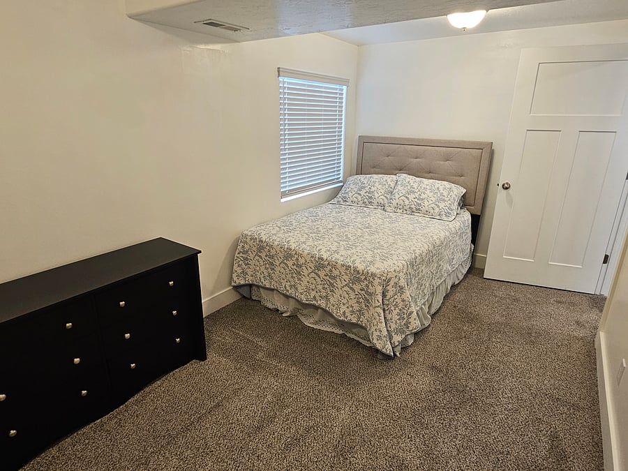 Walk in closet bedroom, with a Full Bed.