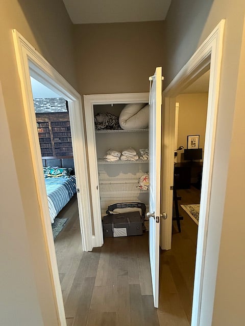 Hall closet, between Bedrooms 1 and 2. Includes pack-n-play. 