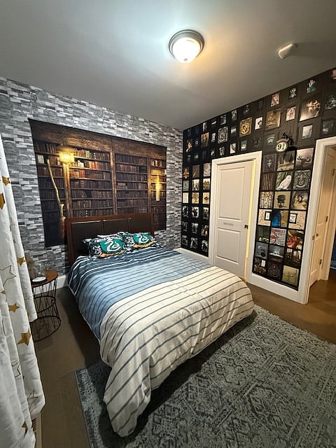 Bedroom 1 includes a Queen sized bed, walk-in closet and themed decor. Window faces North.