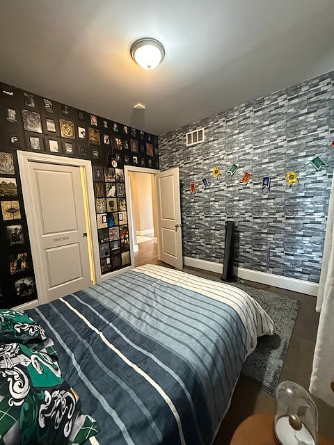 Bedroom 1 includes a Queen sized bed, walk-in closet and themed decor. Window faces North.