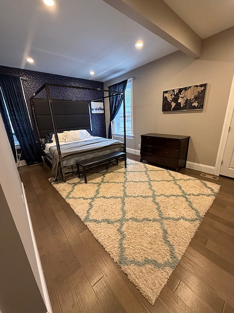 Main room, bathroom is to right, visable door is to private sunroom.