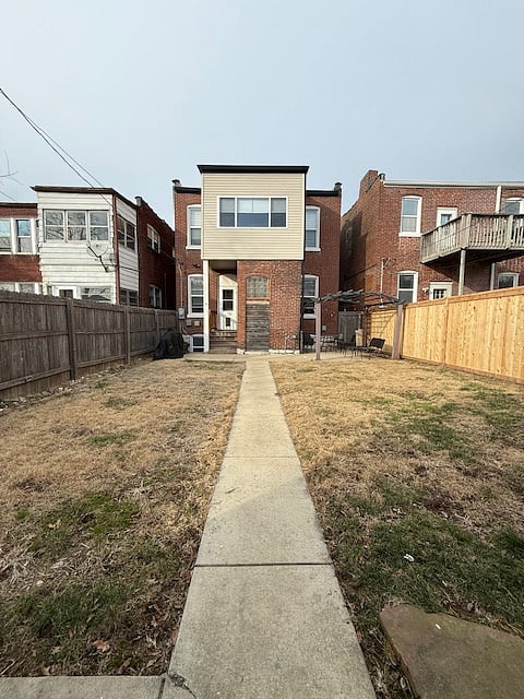 View of back of house. Please note: stairs are required to enter at both front and back of house.