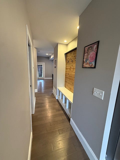 "Mud room" area for shoes and coats, next to main floor bathroom.