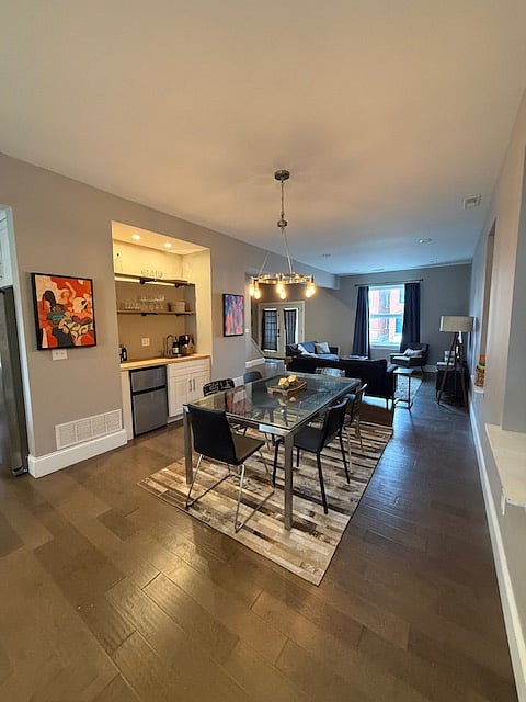 Dining room, wet bar and living room. Looking North.
