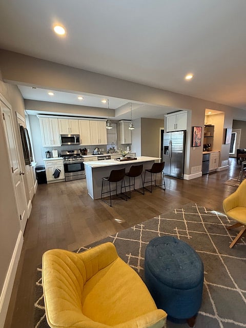 Kitchen and island seating, view from den.