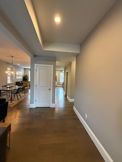 View as you enter front doors. Stairs to the right, living room to left. Hall closet. Looking South.