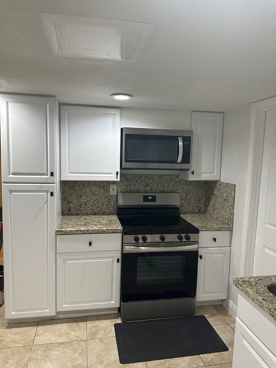 Kitchen Microwave & Range with Granite Counter Tops & Backspash