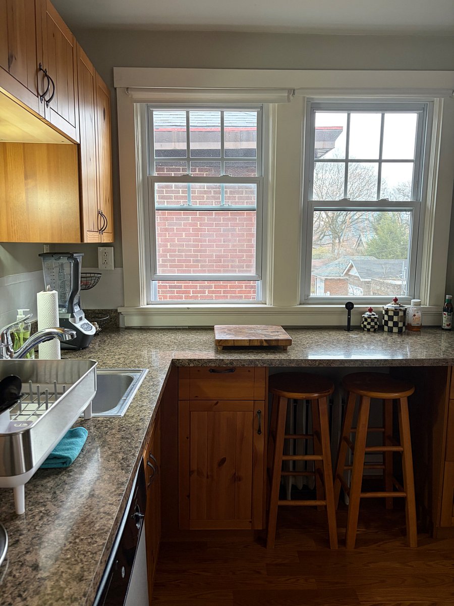 Full kitchen with dishware, gas stove, coffee station.