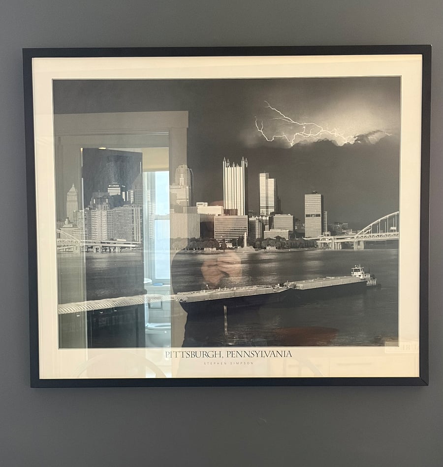 Apartment features curated artwork throughout.