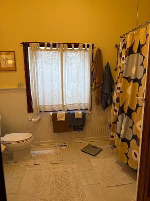 large clawfoot tub and natural lighting make this space so inviting