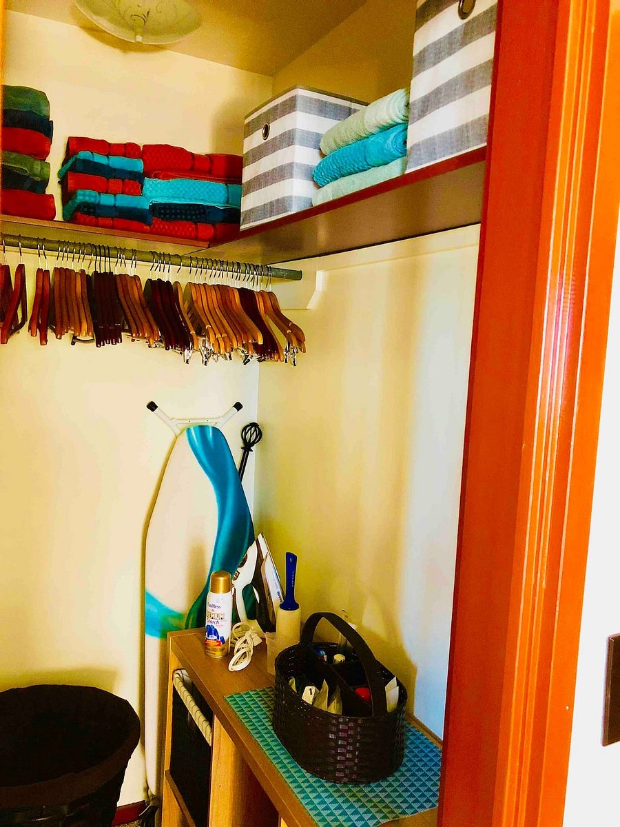 Our linen closet is adjacent to the bathroom & comes with plenty of linen, a laundry hamper and iron.