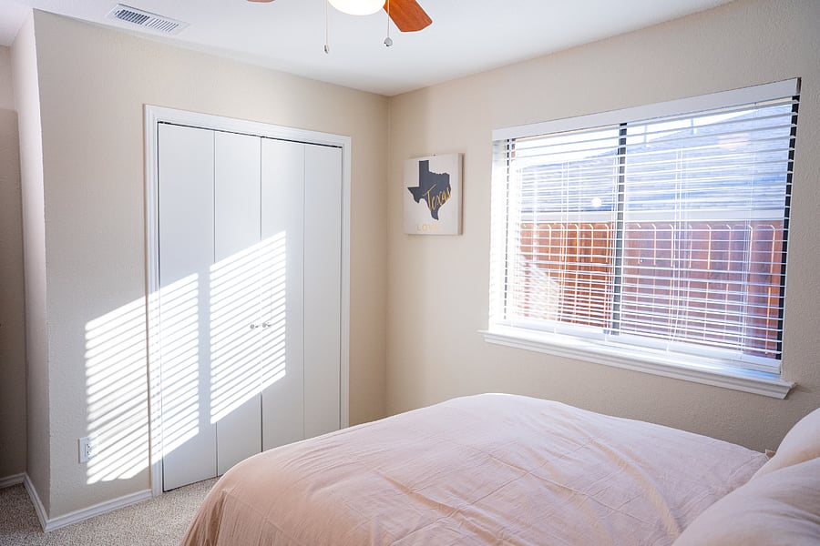 Light-filled, private window with sun-blocking blinds.